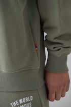 WORLD FAMOUS AZAT MARD TEAM TAUPE SWEATER