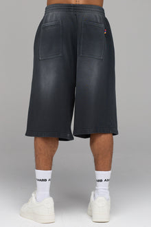 LES GENS JOGGER MIT GERADEM BEIN IN WASCHUNG SCHWARZ MIT GELB
